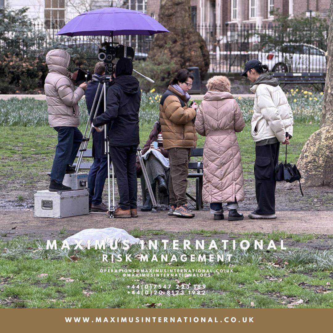 Discreet security protecting high profile talent during filming in a public location